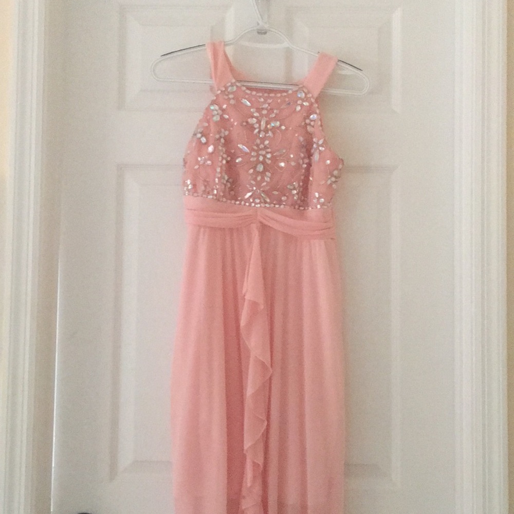 Pink bejeweled formal gown.